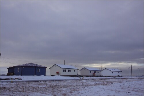 Figure 8. Experimental house on the left (photo courtesy of the Cold Climate Housing Center).