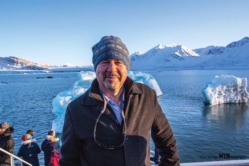 Figure 3. Mann at King’s Bay amid calving glaciers, in Spitsbergen Svalbard—an archipelago between mainland Norway and the North Pole. Image courtesy of Michael Mann.