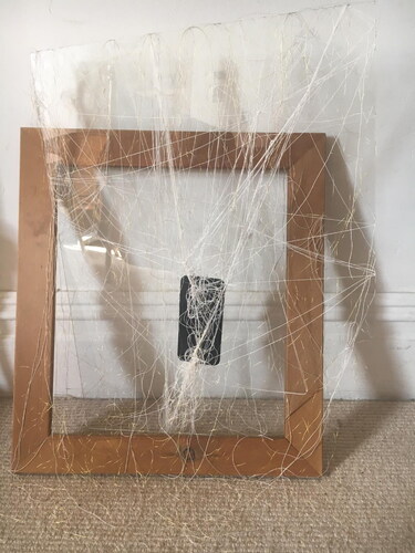Figure 2. Screen/mind theory (2020), iPhone, cotton and metallic thread, acrylic and wooden frame.