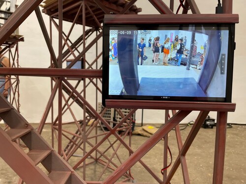 Figure 6. Detail of art installation showing footage of CCTV camera recording from inside the maquette. Photo by Melita Couta.