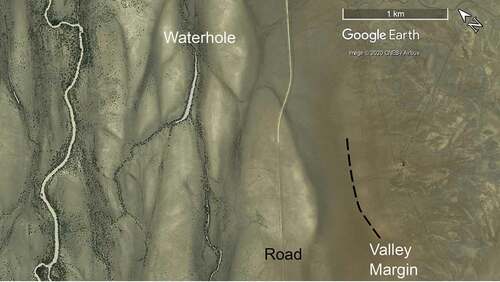 Figure 4. Part of the Thomson River macrochannel, containing a channel (far left), a waterhole, dark grey anastomosing floodways and pale grey braid-like floodplain bars. The valley margin is indistinct (dashed line), and the hillslope (right) shows mottling characteristic of Rolling Downs Group subcrop. Vertic Downs landscape zone, along the Muttaburra-Longreach road (−23.09° 144.48°), flow top to bottom.