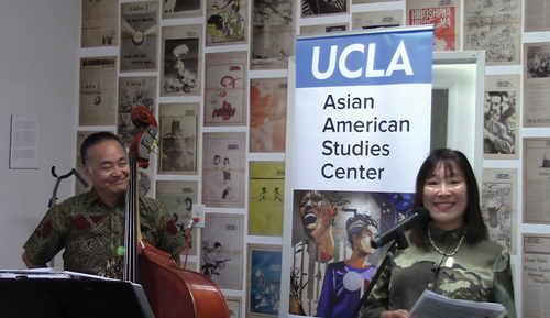 Amy Uyematsu (R) and bassist Taiji Miyagawa (L) perform readings at the UCLA Asian American Studies Center’s Mountain Movers book launch at First Street North in Los Angeles’s Little Tokyo (2019). Courtesy of UCLA Asian American Studies Center.