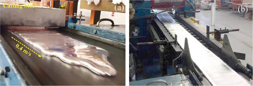 Figure 9. Pilot-scale horizontal single belt casting system used to process 7–10 mm thick, 250-mm wide strips of AA6111 aluminum alloy: (a) view toward the feeding system at the beginning of casting and (b) view toward the pinch roll mini-mill during casting (reprinted with permission from Gonzalez-Morales, Isac, & Guthrie, Citation2023a)