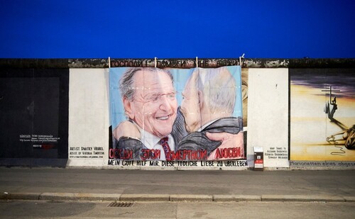 Figure 7. Makeshift pop-up street art at the East Side Gallery in Berlin depicting a Schröder/Putin embrace (Reuters).