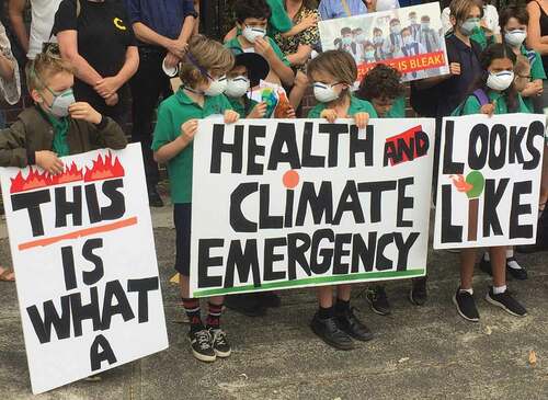 Figure 3. Becoming-activists. Local inner-city school protest organised in solidarity with schools across the country. For middle-class settler families to be connecting individual respiratory illness to planetary malady demonstrates an emerging capability to attune and respond to human-climate transcorporeality. Image: Author.