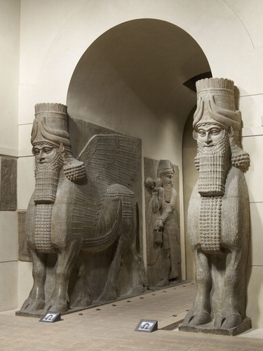 Figure 3. Assyrian shedu or lamassu, winged bulls who guard gateways, relocated from northern Iraq to museums in London and Paris during the 1850s. Photo © Musée du Louvre, Dist. RMN-Grand Palais / Thierry Ollivier.