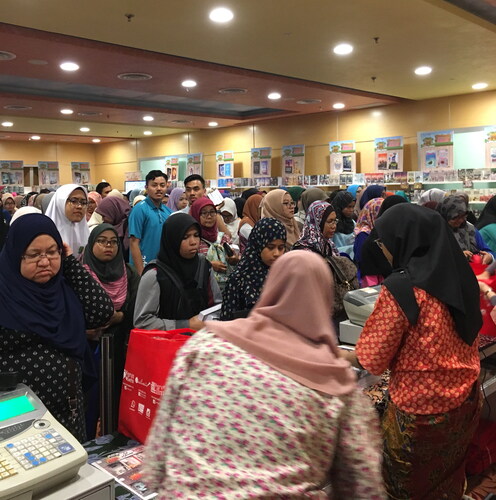 Figure 1. Readers queuing to purchase romance novels at the 2018 Kuala Lumpur International Book Fair. Photograph by the author.