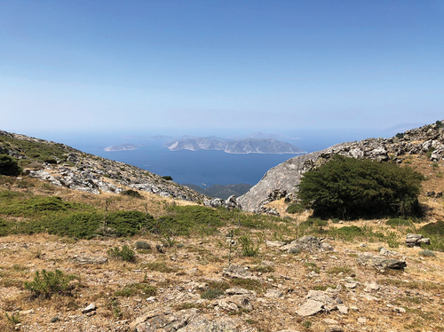 Figure 2. View from Mt Kerkis, west Samos. The Fournoi archipelago is visible in the foreground, and the tip of Ikaria is just visible to the right side of the photograph. Photograph by the authors.