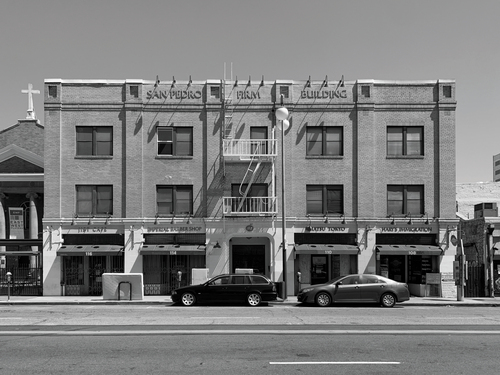 Figure 1. Renovated by the Little Tokyo Service Center in 1991, the San Pedro Firm Building today consists of four ground level storefronts and forty-two studio apartments for very low-income residents. Photograph by authors.