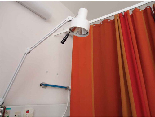 Figure 2. Red curtain between two beds in a patient room