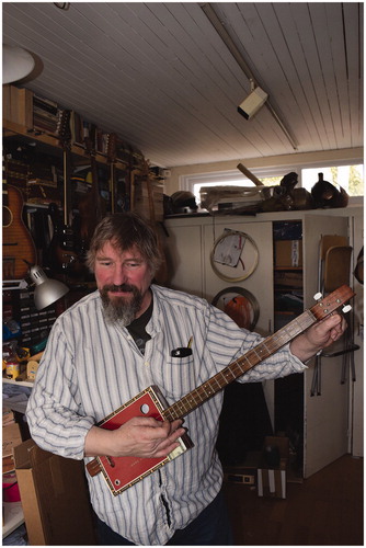 Figure 10 Chickenbone John with a guitar made for him by a friend.