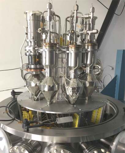 Fig. 2. The KRUSTY PCS consists of two 80-W–rated Stirling converters and six simulators (which mock the thermal behavior of the converters). At the bottom is the flange for the vacuum vessel. Over 100 TC wires and connections are packed between the flange and the PCS.