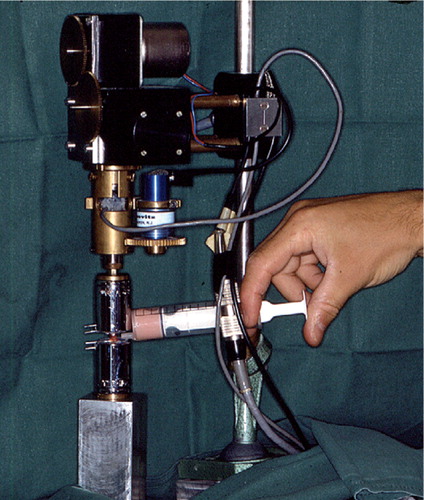 Figure 1. Specimen is seen fixed to the level of the pin close to the fracture or at a corresponding mark on the contralateral bone. Polymer monomer compound was used in the specially developed torsion test equipment.