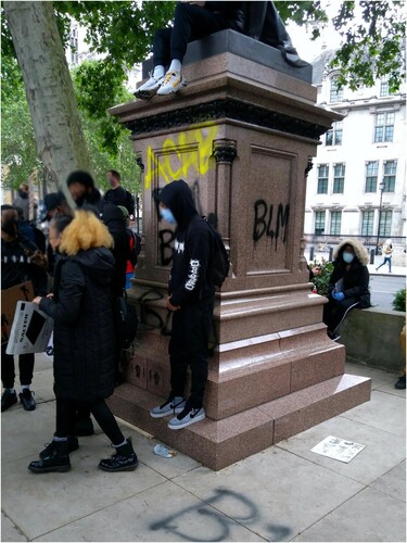 Figure 2. Defaced statue in Parliament Square on 6 June, bearing the acronyms ‘BLM' and ‘ACAB'. Author’s photo.