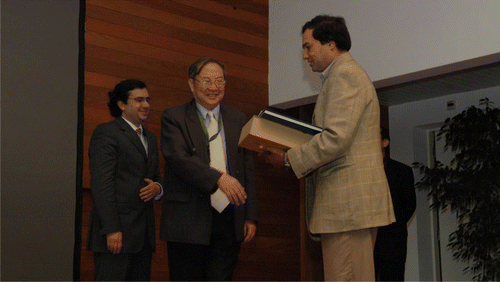 Figure 2.  Professor Yan receiving a research award delivered by Professor Bidanda (Pittsburgh University) during the 2nd International Conference on Advanced Research in Virtual and Rapid Prototyping (VRAP2005), Leiria, Portugal.