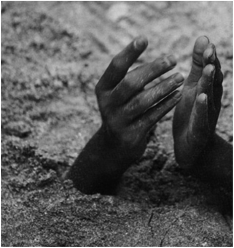 Figure 3. Photograph of unnamed Samadhi Yogi from India, depicted from an unknown book of the Author’s childhood (FAM Manno). The picture is on pages 58 and 59 of this book with the chapter possibly titled as “States of Mind.” The caption reads: “Buried alive with his praying hands toward heaven, an Indian yogi is in a trance-like state that reduces his requirement for oxygen.” The author (FAM Manno) would be greatly in debt to the individual who helps him find the title of this book. The beginning of the chapter reads: “Waiting to be buried alive, the yogi sits in cross-legged meditation, half-lidded eyes staring at no one definable spot. University researchers check their watches, eager to demystify the demonstration of mastery over conscious functions. Eventually the ascetic senses that he is ready, rises, and walks with a sleepwalker’s gait to a pit in the ground. He will remain without oxygen for 45 minutes. And he will survive.” (Unknown book, Chapter; States of Mind, p. 59). Any and all help identifying this book would be appreciated.