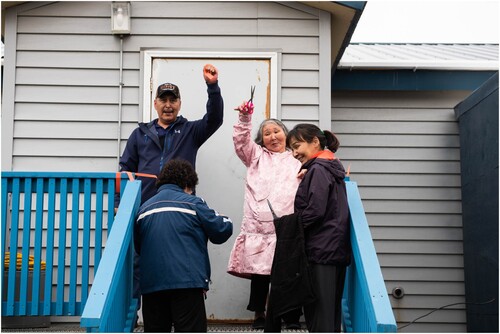 Figure 7. Warren Jones and Grace Hill of Qanirtuuq Inc. cutting the ribbon at the opening of the Culture Centre (also pictured Annie Wassilie and Jamie Small). Picture by Katie Basile/KYUK, used with permission.