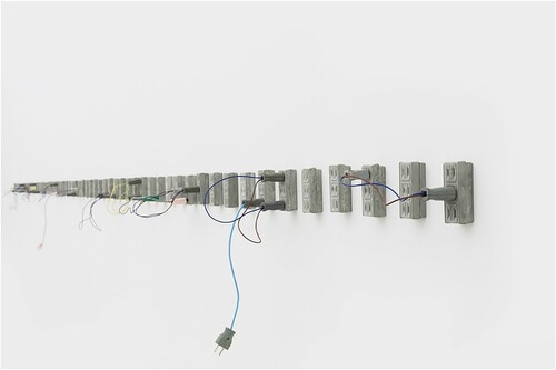 Figure 9. Zhang Ruyi, Flow Away (2016), installation view, cement, plug, electric coil, dimension variable. Photo: courtesy of the Zhangruyi.com.