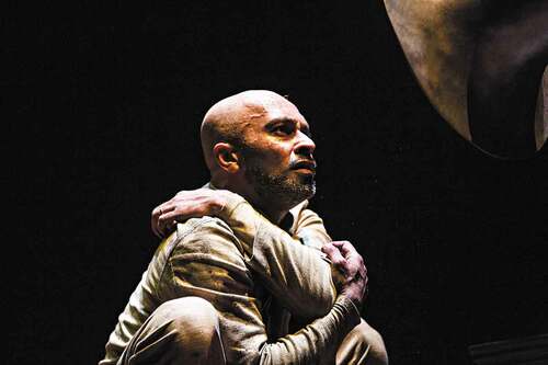 Image 1. Akram Khan stares into the gramophone that starts to list names of Indian colonial soldiers in WW1. In XENOS by Akram Khan Company at Onassis Cultural Centre, Athens, February 2018. Photo: Jean-Louis Fernandez.