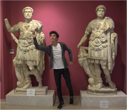 Figure 7. A university student poses for a photograph with armless statues in the Tlos Gallery at Fethiye Museum. (Photo credit: Gülşen Yegen for FETAV).
