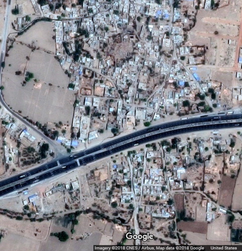Figure 8. A six-lane national highway passing through a village (Source: Google Earth snapshot).