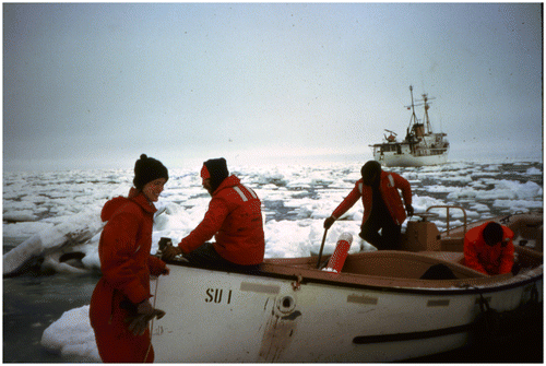 Figure 5. Claire on an ice floe in the Bering Sea, about to step into a boat to head back to the main ship, Surveyor, in the background, March 1981.