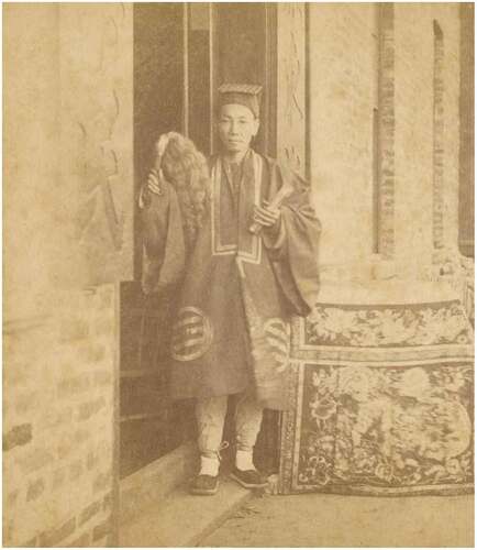 Figure 1. A Huoju Daoshi standing in front of his Namo Daoguan in the Guangdong area in the first years of Emperor Guangxu of the Qing Dynasty (Source: by Shuzhen Liu).