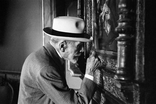 Fig. 5. Bernard Berenson looking at a painting with a magnifying glass at the Borghese Gallery, Rome, Italy, 1955. Photo: David Seymour/Magnum Photos.
