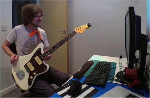 Figure 7. Guitarist using the Stretchy Strap with SoundSlice.