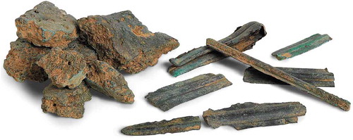 Figure 3. Fragments of oxhide ingots and of votive swords from Giva ’e Molas, Villamar, Cagliari province, Archaeological Museum Villa Leni of Villacidro (courtesy of Ilisso Edizioni, Nuoro, Italy).