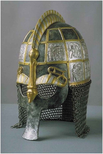 Figure 6. A recreation of one of the Vendel ceremonial helmets (500–700 AD). Notice how a foil from Plate D of the Torslunda die, depicting Odin a wolf-warrior participating in the weapon dance, is featured prominently for all to see (top right design). When worn in a fire-lit hall, this design would be emphasized by the light, connecting the owner to this ritualistic tradition. (Deligiannis 2012)