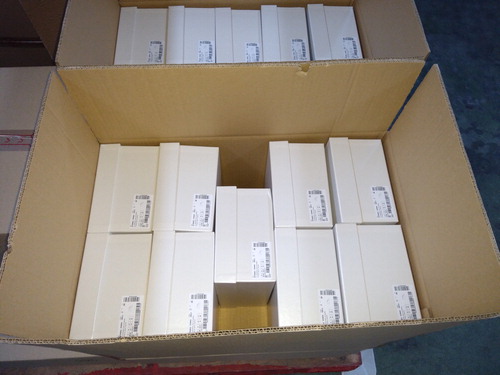 FIGURE 1 A CARDBOARD CONTAINER CONTAINING THE SHOE BOXES