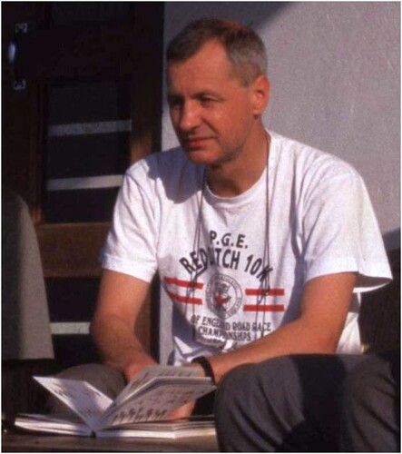 Figure 1. Brian O’Shea on the British Bryological Society Tropical Bryology Group Expedition to Uganda, 1997, consulting a book on the local avifauna. Photograph: Ron Porley.