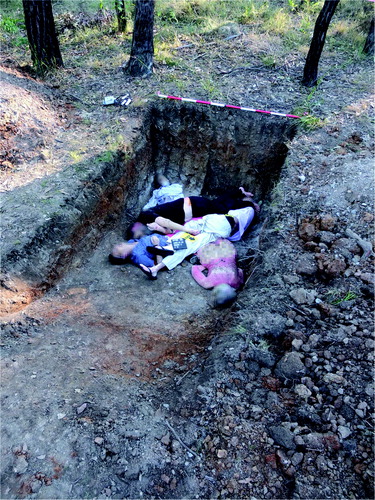 Figure 7. Human cadavers in GR5 prior to placement of temperature and moisture data loggers and backfilling.