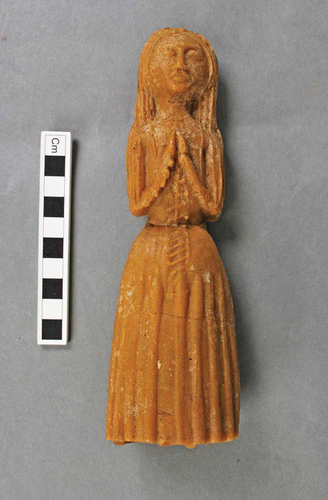 Fig. 5. Wax votives from Exeter Cathedral. A complete female figure in a prayer position. © the Dean & chapter of Exeter Cathedral.