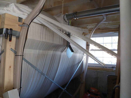 Figure 1. A typical wood storage container (bag) used for storage of bulk pellets. The temperature and CO monitors are shown in the upper left corner.