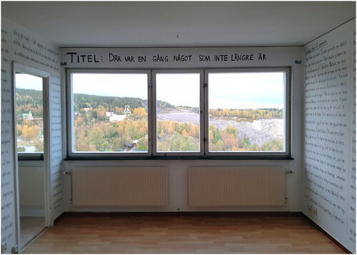 Figure 3 David Väyrynen’s contribution to the FARVÄL FOCUS Festival, Malmberget, 2019, curated by Pernilla Fagerlönn. Title: “There Was Something that Exists No Longer.” Kaptensgruvan is visible from the room on the eleventh floor of the focus huset. Photo: Pernilla Fagerlönn, 2019.