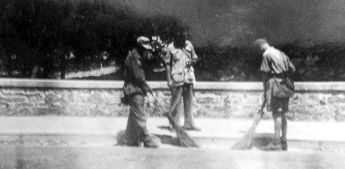 Figure 3. Italian POWs cleaning a street in Zichron Ya‘akov, under the watch of Y. Leitner, circa 1944 (Leitner family papers).