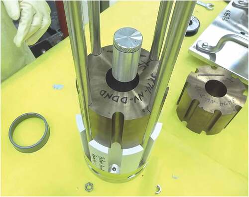 Fig. 1. Partially assembled configuration for the component criticals. The first (of three) HEU UMo core segments rests on top of the lower BeO axial reflector. The central cylinder aids assembly and alignment and is later removed.