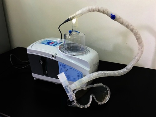 Figure 1 Ultrasonic nebulization system developed in this study.